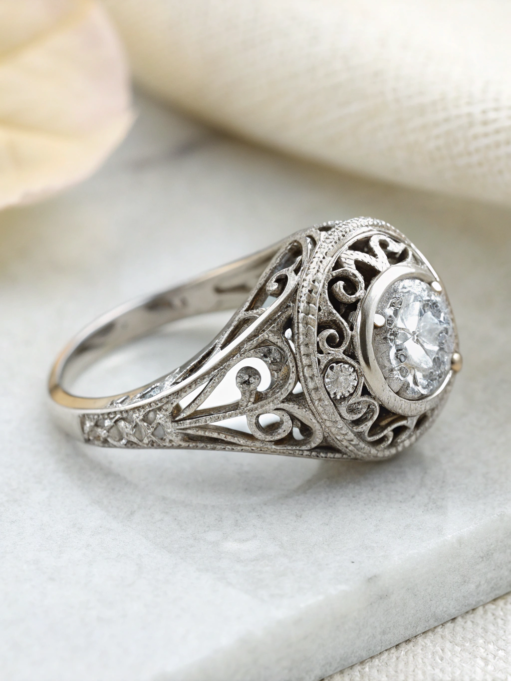 Final polished platinum ring with intricate filigree